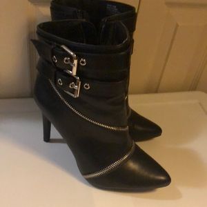 Black ankle boot with stiletto heel and buckle zipper design